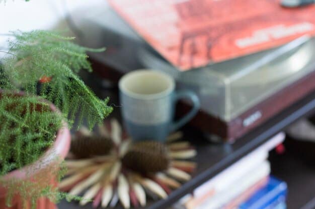 A close-up shot of a curated coffee table display featuring a stack of design books, a small sculptural object, and a scented candle, all arranged in an aesthetically pleasing manner, adding a touch of sophistication and personality to the living room.