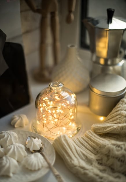 A serene bedroom featuring soft ambient lighting from bedside lamps and a warm glow from a string of fairy lights. The color palette is muted and calming, promoting relaxation and restful sleep.