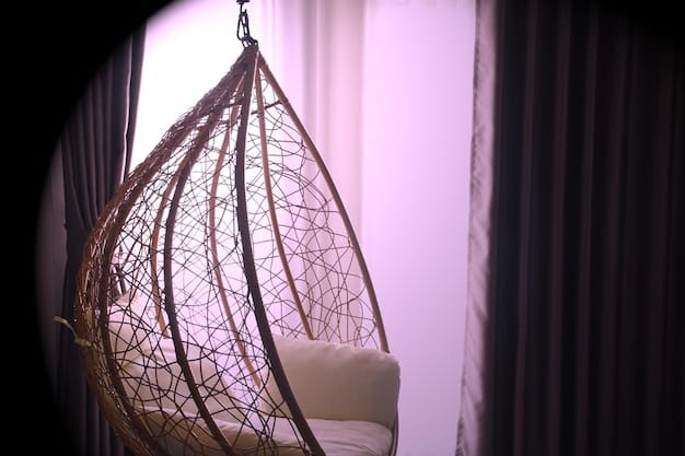 A modern reading nook featuring a hanging chair suspended from the ceiling, adorned with soft cushions and a sheepskin rug underneath, surrounded by potted plants and a small bookshelf with colorful spines.