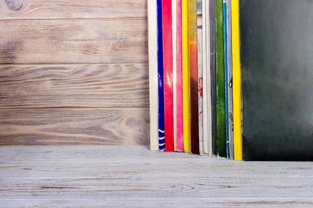 A close-up of a wooden bookshelf showcasing a variety of books arranged by color. The bookshelf also features small potted plants, decorative bookends, and woven baskets. The image is well-lit and focuses on the textures and patterns of the items on the shelf.
