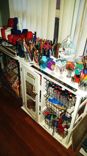 A cluttered shelf filled with mismatched accessories of various sizes and colors. The shelf lacks a cohesive theme and appears disorganized and overwhelming.